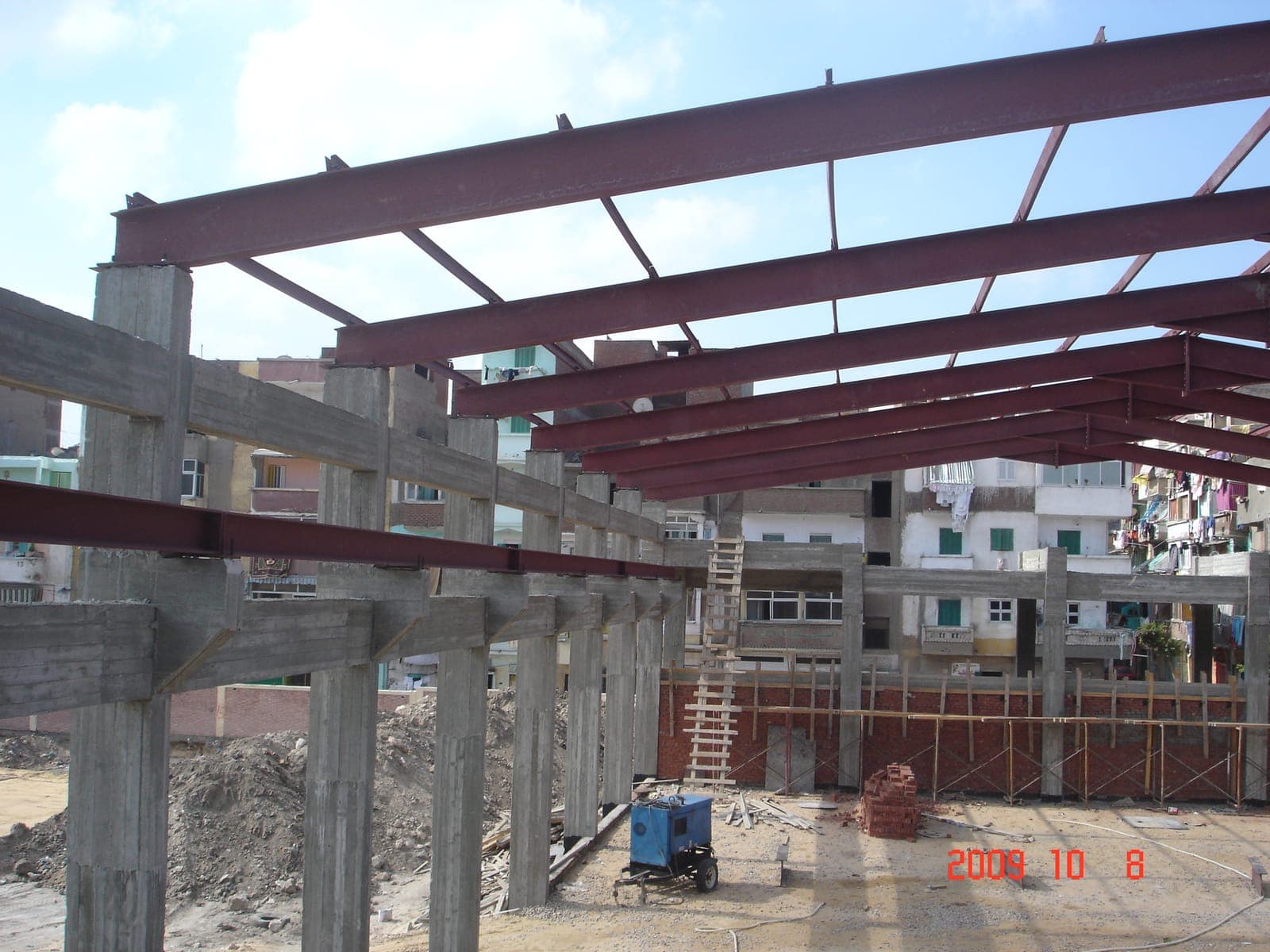 Alsiham Building — steel roof beams landing on concrete columns