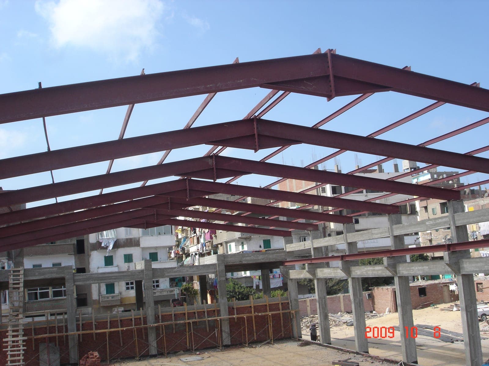 Alsiham Building — the steel roof grid during erection
