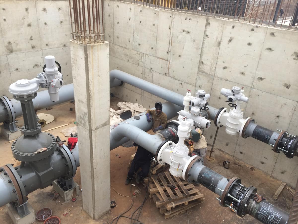 Flanged valves and pipework inside a hydrant valve chamber at Cairo Airport Terminal 2