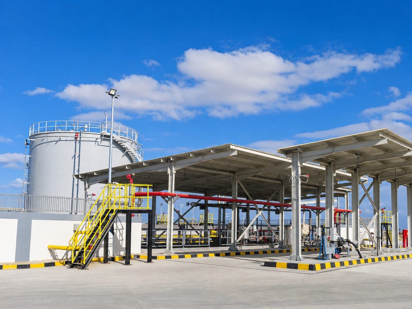 Fuel storage tank and steel loading canopy at the Al-Alamein fuel depot
